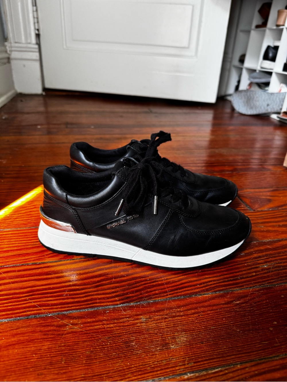 MICHAEL Michael Kors Black Leather Sneakers with White Sole and Silver Accent